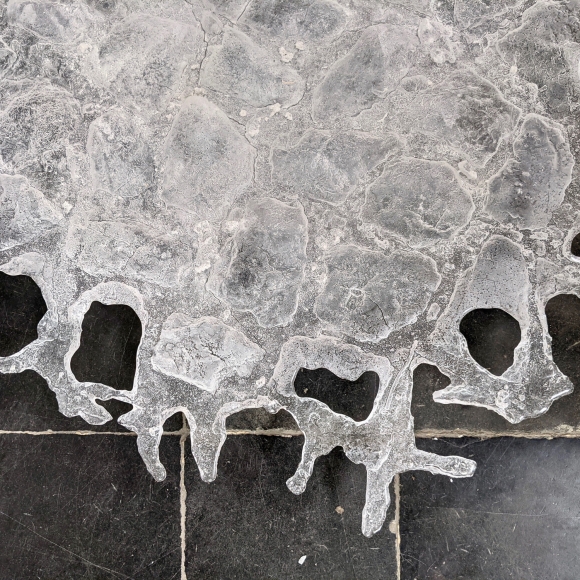 glass rain puddle street stones